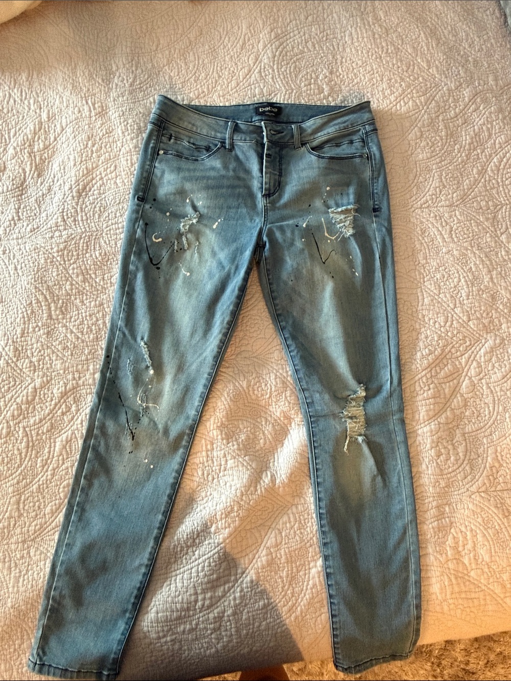 Bebe size 29 Light Blue Skinny Jeans with Distressed Paint Detail